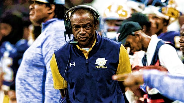 ERIC DOOLEY PONDERING ON SIDELINES